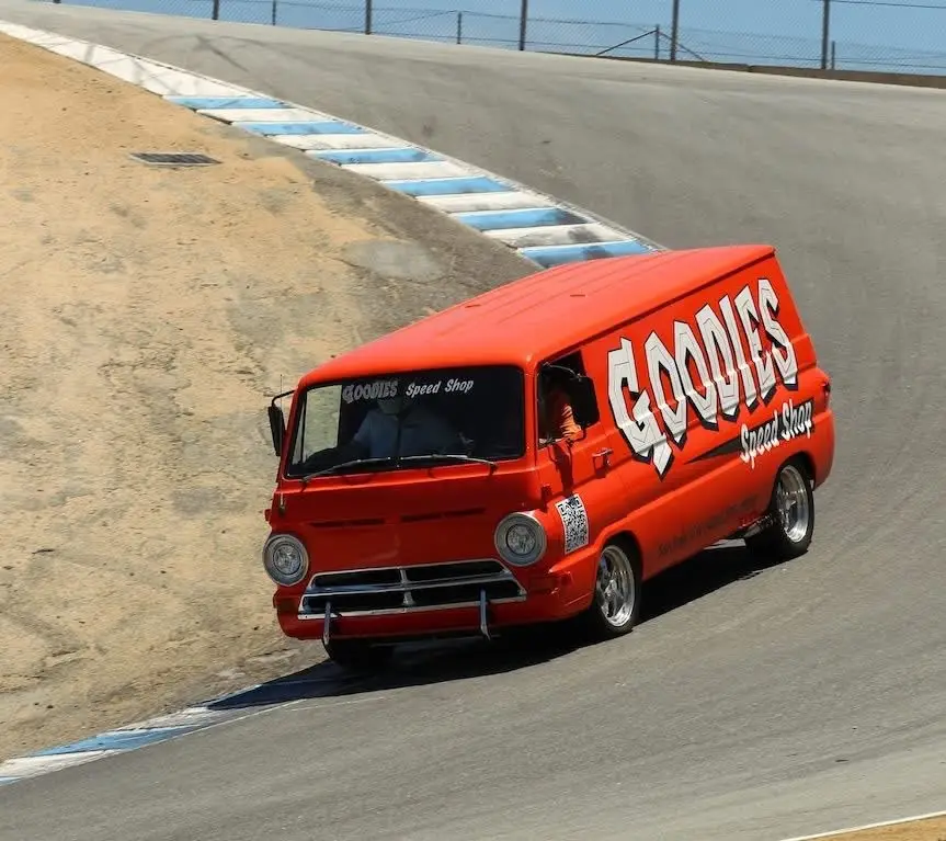 Goodies Speed Shop orange van at the corkscrew (Laguna Seca)